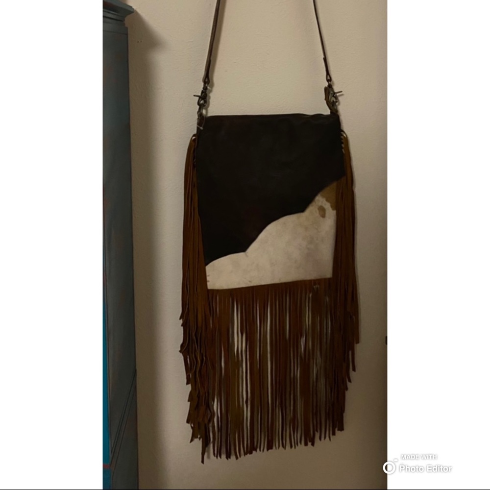 American darling bag with tooled strap. Never used.